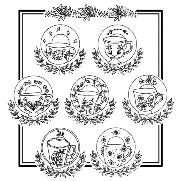 Collection of Aunt Martha’s floral teacups and teapots surrounded by laurel wreaths