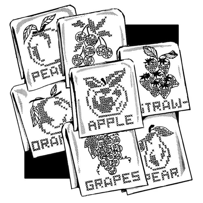 Cross-stitched fancy fruit designs on fabric squares for Aunt Martha’s® countryside quilts