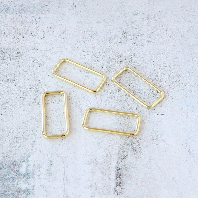 Four 2in Rectangle Rings Gold