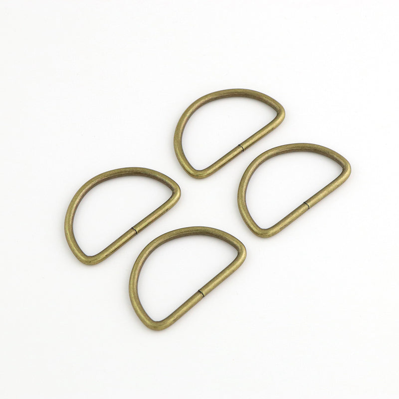 Four 2in D-Rings Antique