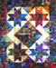 Colorful patchwork quilt featuring geometric star patterns from Aries Stars Project