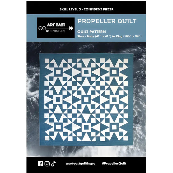 Geometric triangles and squares in the Art East Quilting Propeller Quilt Pattern design