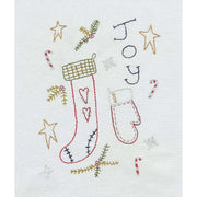 Hand-embroidered Christmas stocking and mitten from Aunt Martha’s Primitive Christmas collection