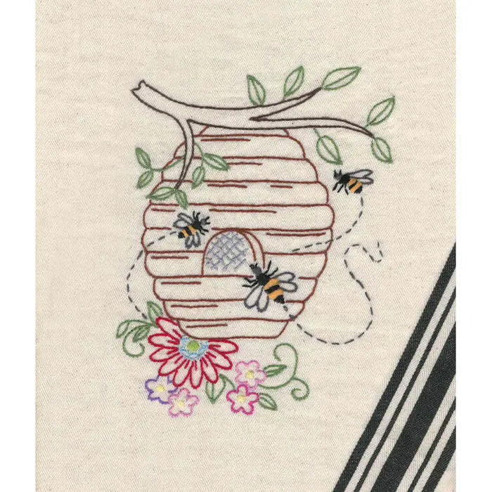 Embroidered beehive with bees and flowers from Aunt Martha’s Buzzing Bees pattern
