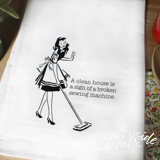 Decorative tea towel featuring Aunt Martha’s Dirty Laundry retro illustration on housework