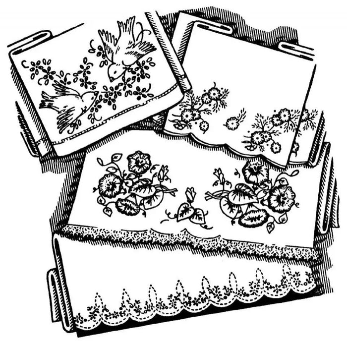 Vintage embroidered linens with beautiful floral motifs and lace from Aunt Martha’s®