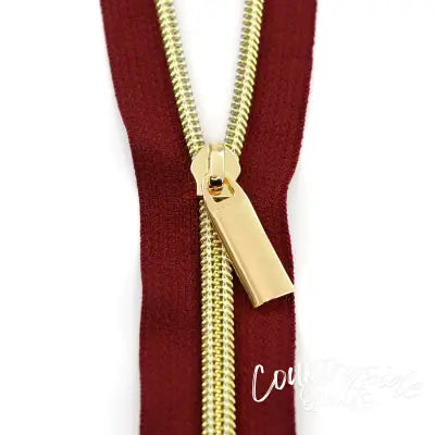 Burgundy #5 Nylon Gold Coil Zippers: 3 Yards with 9 Pulls