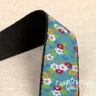 Flowered Webbing on Blue 1-3/16in x 22yds