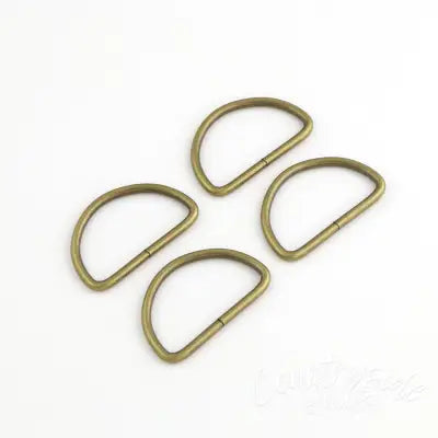 Four 2in D-Rings Antique