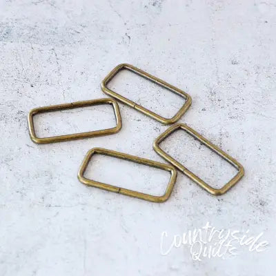 Four 2in Rectangle Rings Antique