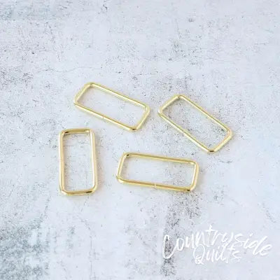 Four 2in Rectangle Rings Gold