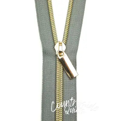 Grey #5 Nylon Gold Coil Zippers: 3 Yards with 9 Pulls