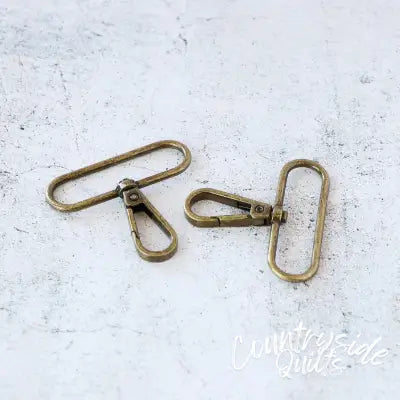 Two 2in Swivel Hooks Antique