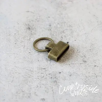 Two Screw-In Key Fobs 1in Antique