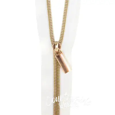 White #5 Nylon Gold Coil Zippers: 3 Yards with 9 Pulls
